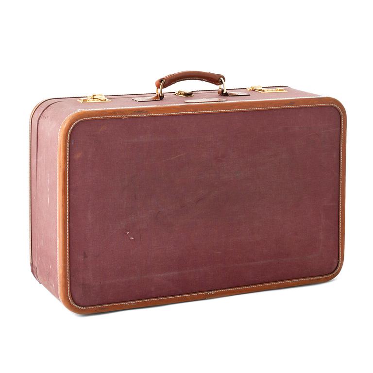 T ANTHONY Ltd, a aubergine canvas suitcase from the 1970s.