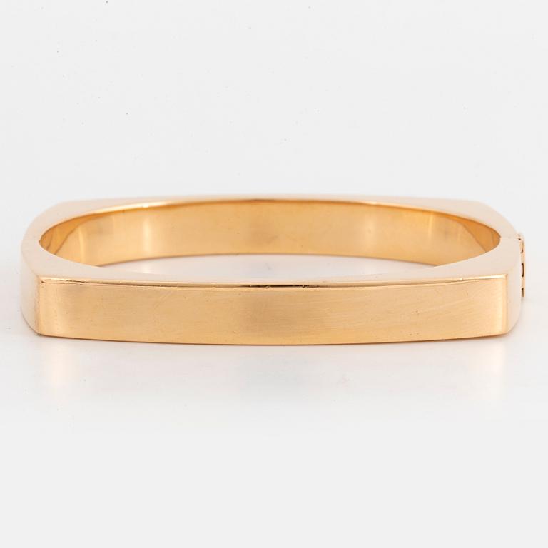 A Gaudy bangle in 18K gold.