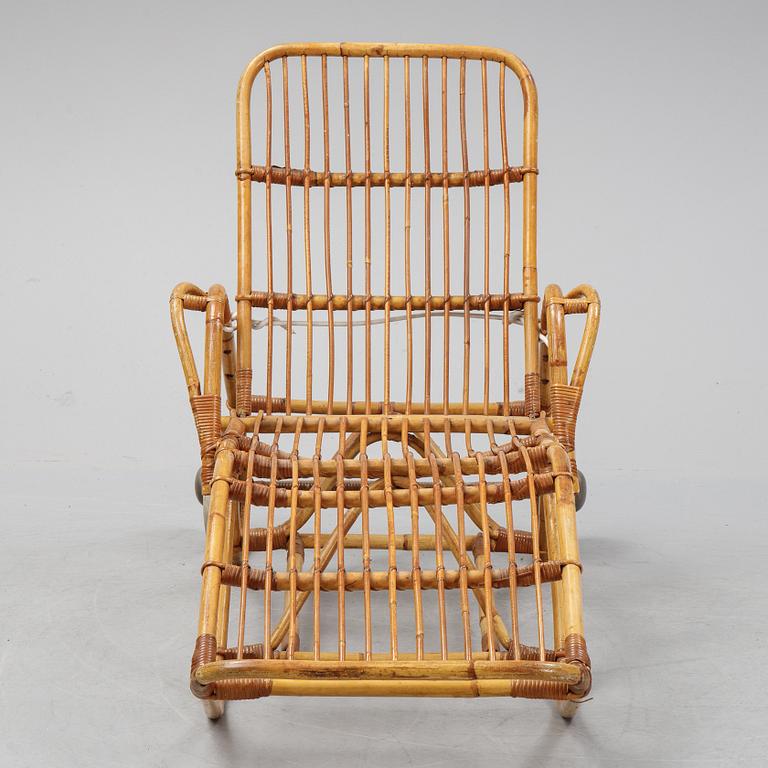 A rattan lounge chair.