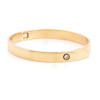 Cartier armband 18K guld med en rund briljantslipad  diamant "Anniversary Bracelet".