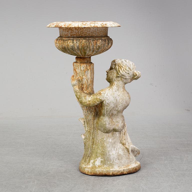 An end of the 20th Century cast iron flower pot.