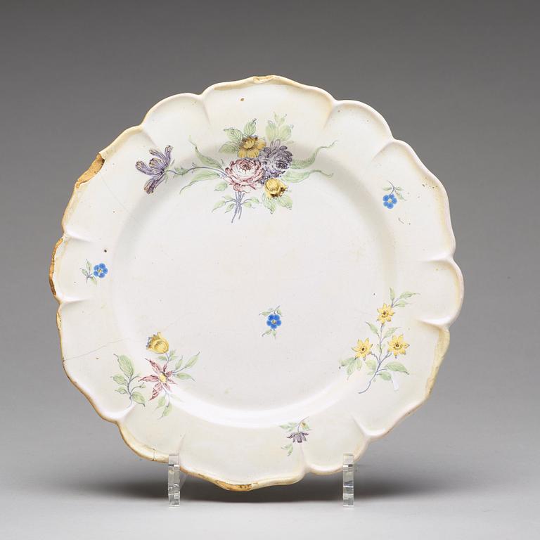 A set of six odd Swedish faience plates, Marieberg and Rörstrand, 18th Century.