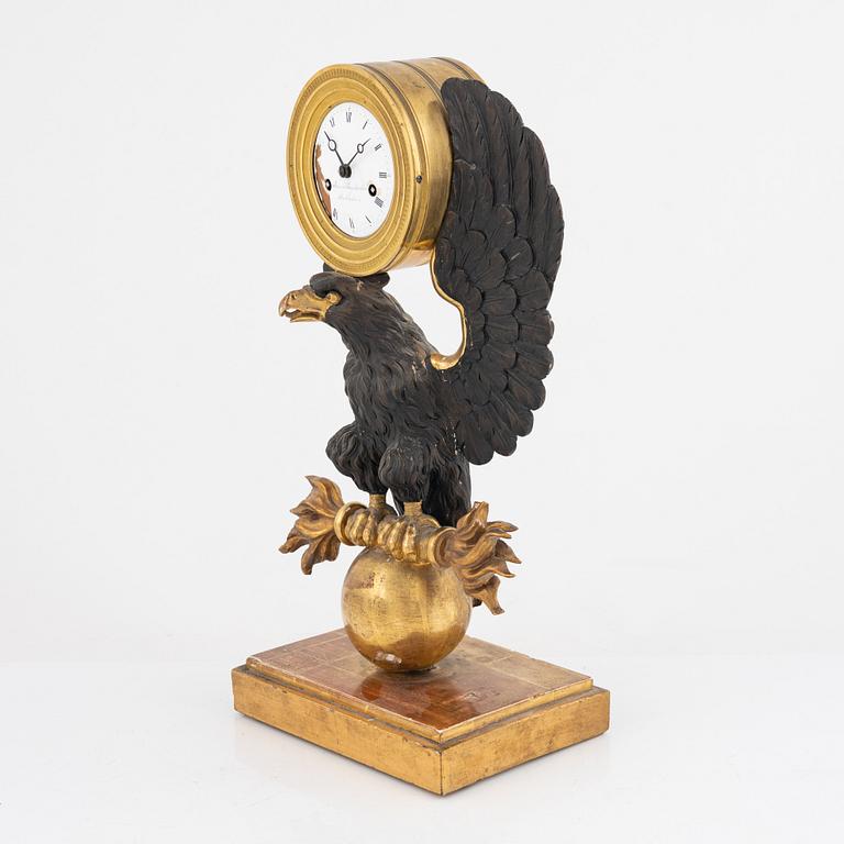 A Swedish Empire giltwood mantel clock by E. Engelbrechten (watchmaker active in Stockholm 1815-45).