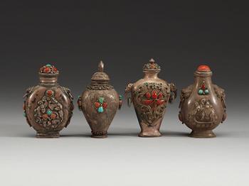 A set of four Tibetan snuff bottles with stoppers, ca 1900.