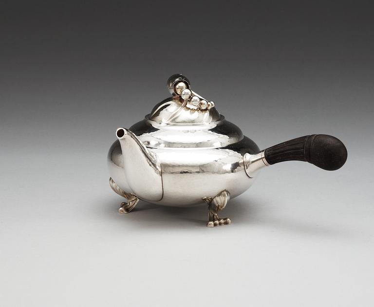 A Georg Jensen sterling 'Blossom' tea-pot, design nr 2D by Georg Jensen, Copenhagen 1996.