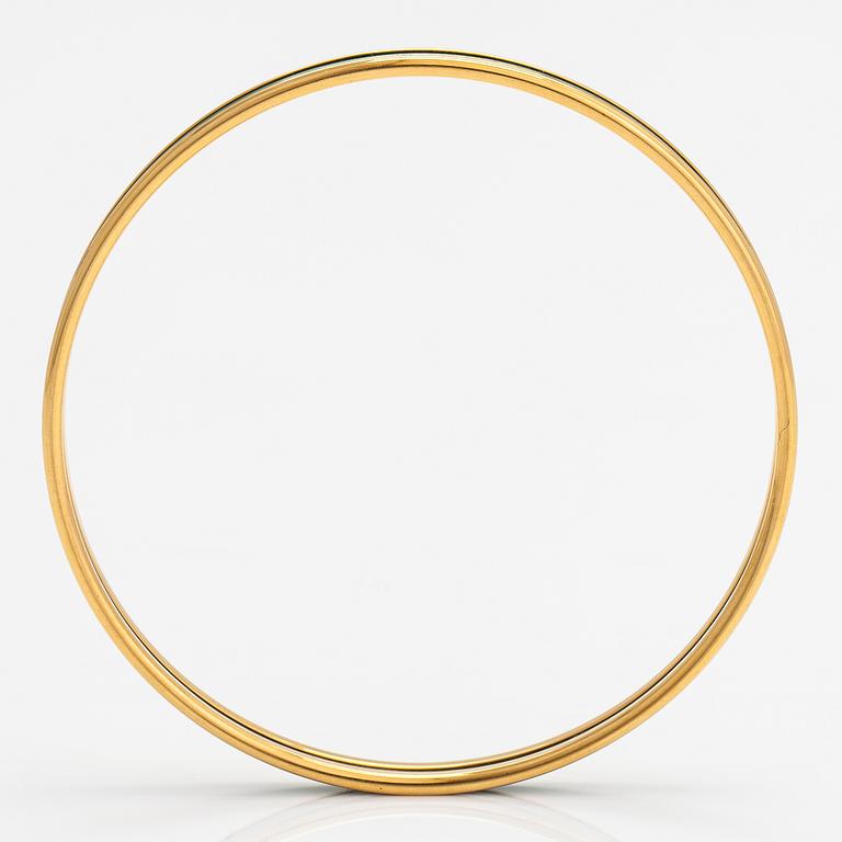 Hermès, a bracelet made of gold coloured metal and green enamel. Marked Hermès Paris, Made in France.