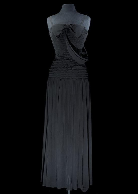 A black silk long dress by Yves Saint Laurent.