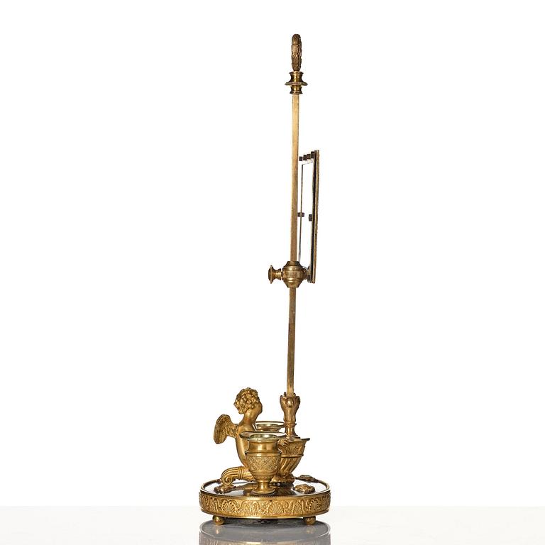 A Russian Empire ormolu and patinated bronse two-light lamp, early 19th century.