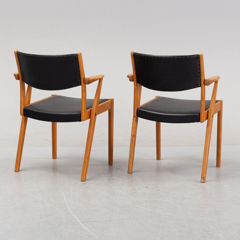 A pair of 1950's/60's armchairs.