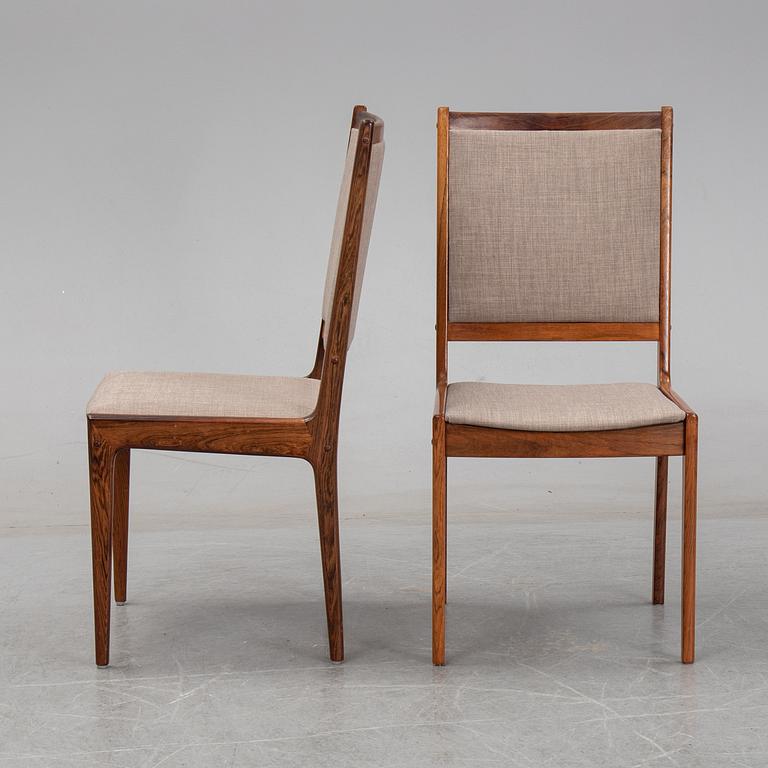 A seven-piece rosewood dining suite, 1960's/70's.