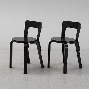 ALVAR AALTO, a pair of painted model 65 chairs from Artek, Finland.