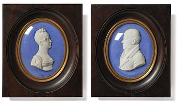 216. A pair of Sèvres biscuit plaques by Alexandre Brachard (1775-1843), dated 1812.