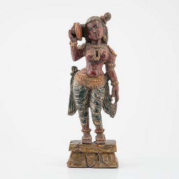 A wooden sculpture of a deity, Indian, 20th Century.