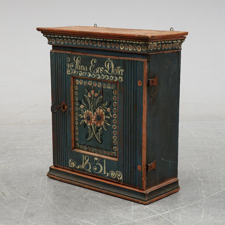A Swedish painted cabinet from Hälsingland, dated 1831.