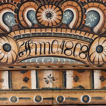 A Swedish Dalecarlian folk art cabinet dated 1808.