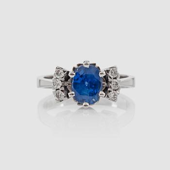 A sapphire and brilliant-cut diamond ring.