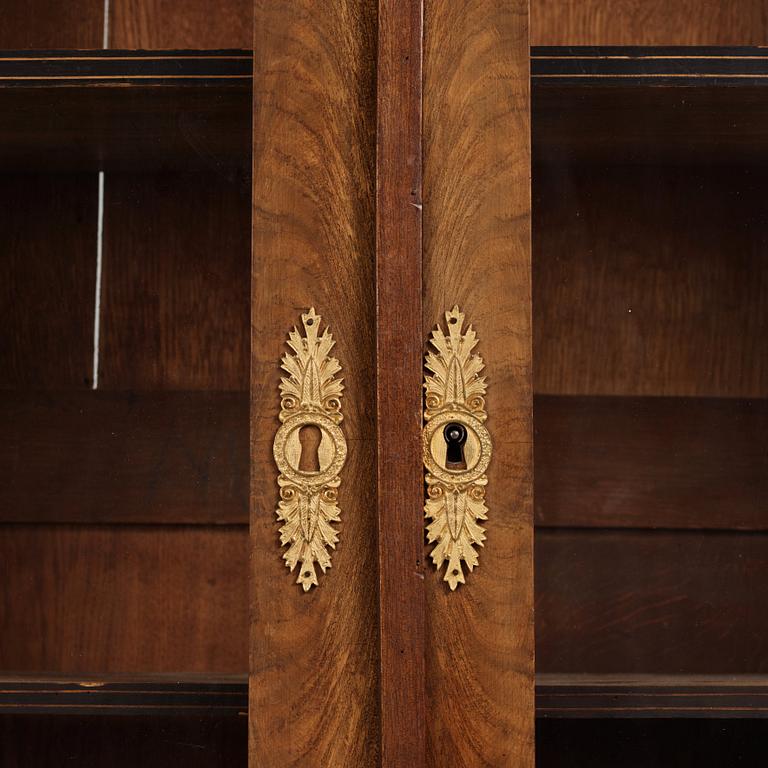 A French Empire mahogany and gilt-bronze mounted bibliothèque, early 19th century.