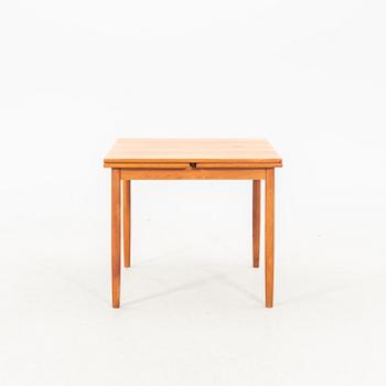 A teak table from the middle of the 20th century.