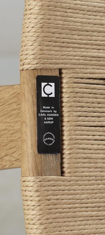 A set of six Hans J Wegner oak 'Wishbone chairs', Carl Hansen & Søn, Denmark.