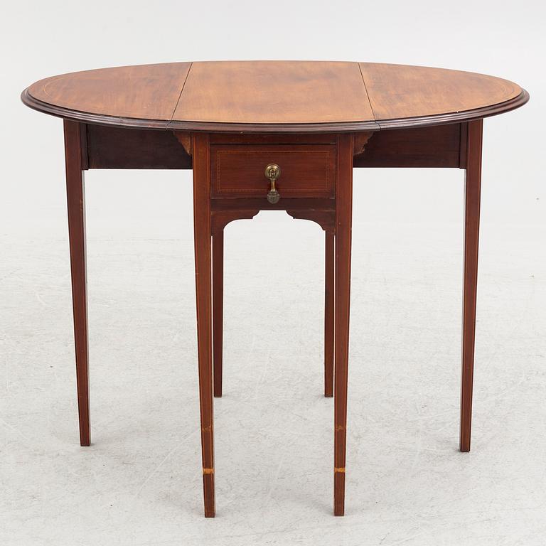 A drop-leaf table, England, early 20th Century.