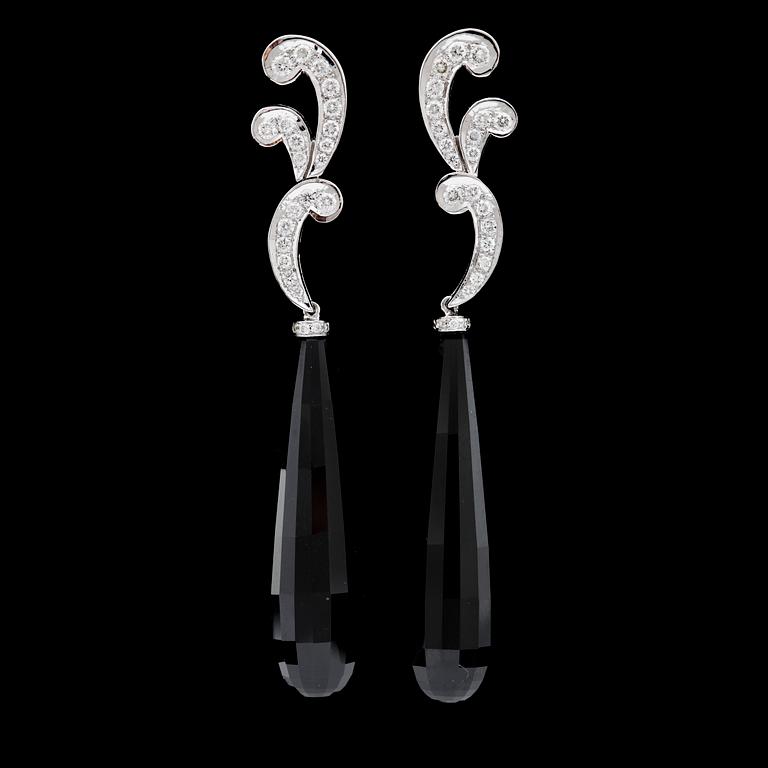 A pair of onyx and brilliant cut diamond earrings, total carat weight circa 0.73 cts.