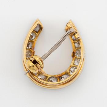 BROSCH, i form av hästsko, guld med gammalslipade diamanter.