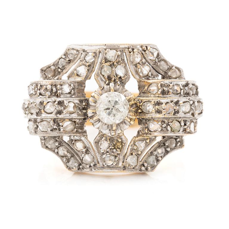 Ring in 18K gold and platinum set with an old-cut diamond and rose-cut diamonds.