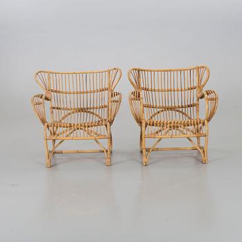 A mid 20th century ratten lounge chairs.