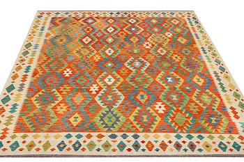 A Kilim carpet, c. 303 x 256 cm.