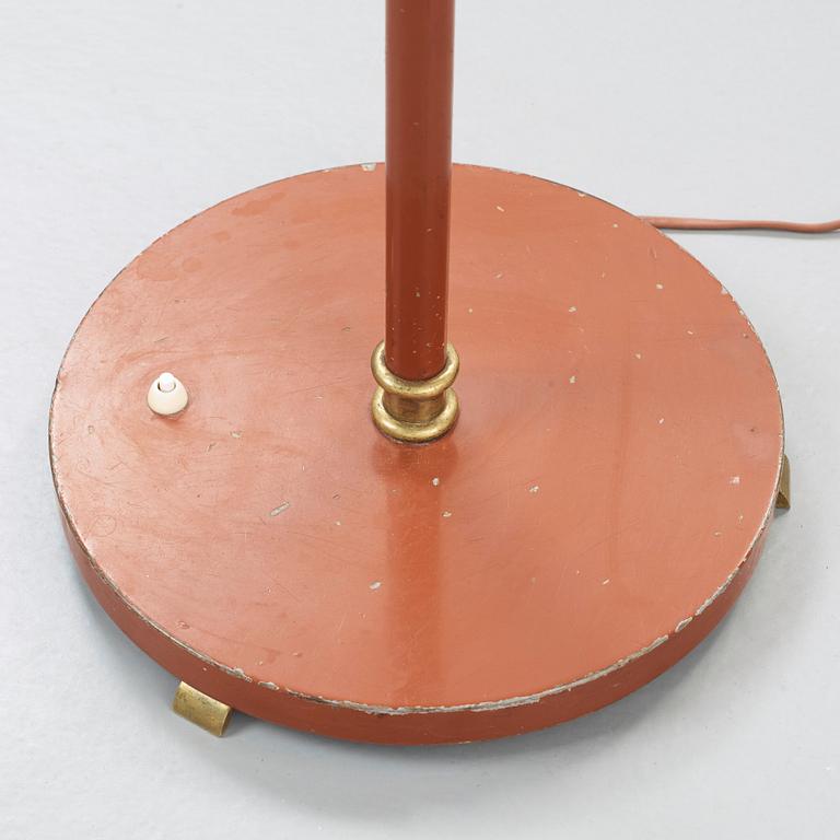 A Scandinavian 1930's-40's brass and lacquered metal floor light.