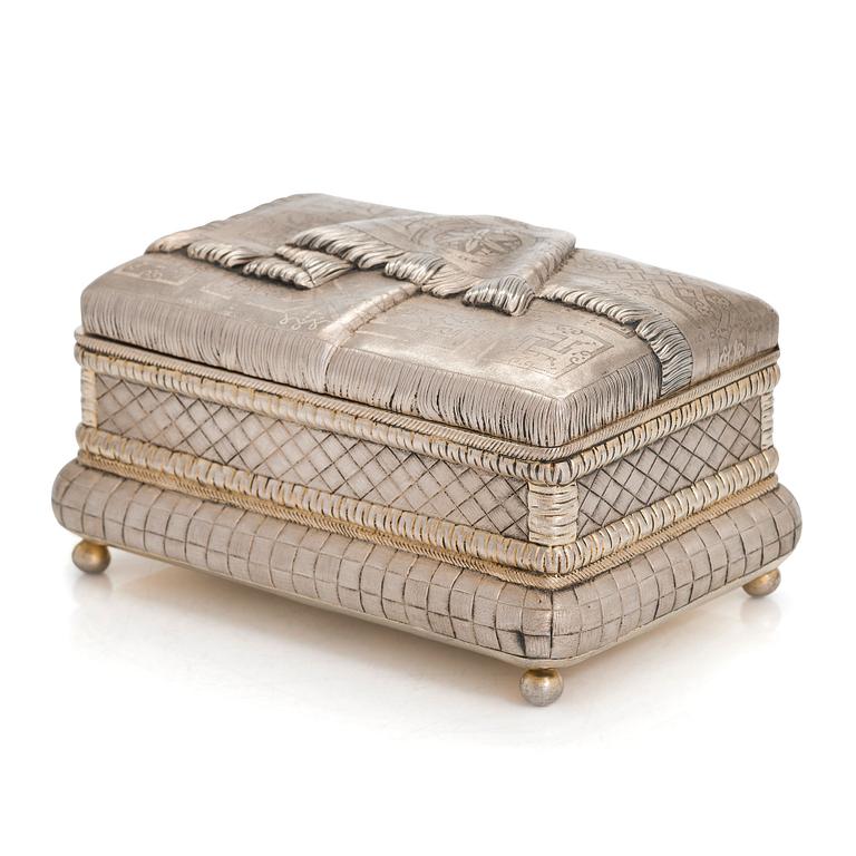 A trompe l'oeil parcel-gilt silver casket, maker's mark of Petr Loskutov, Moscow, Russia 1893.