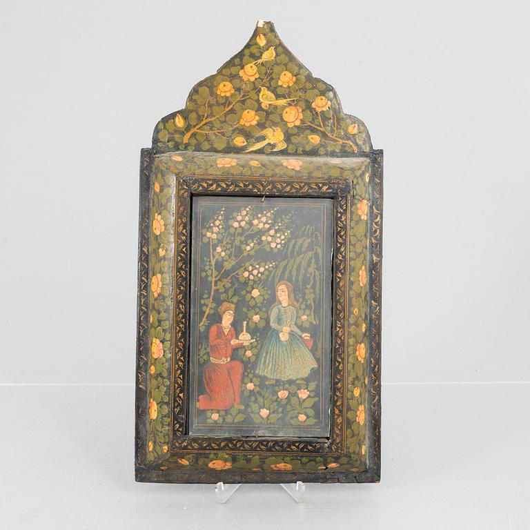 A figure scene in a richly decorated frame, Persia, first half of the 20th century.