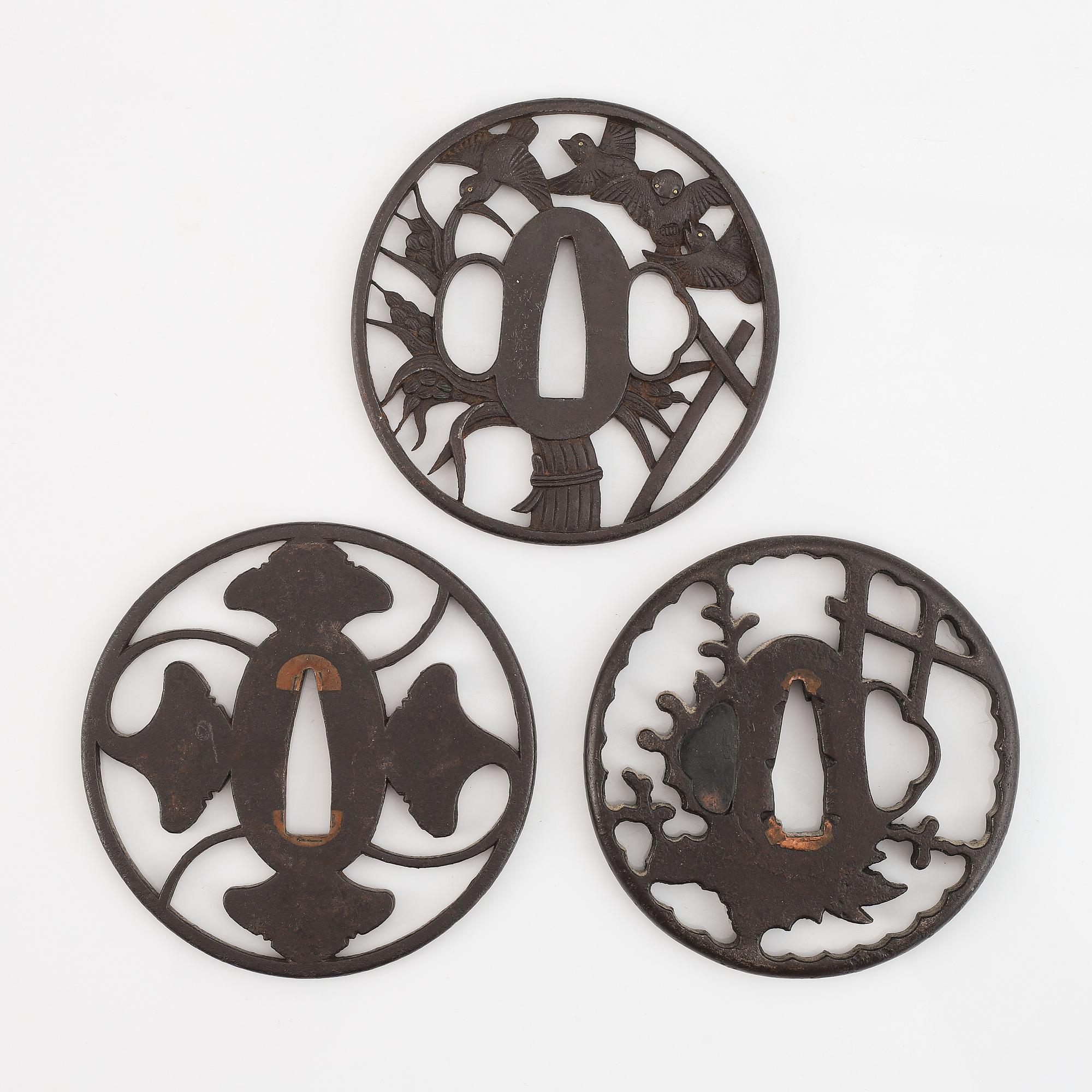 Three Japanese iron Tsubas, late Edo, one signed Kunihiro.