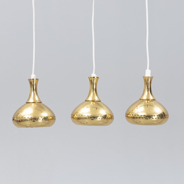A set of three brass pendule lights, second half of the 20th Century.