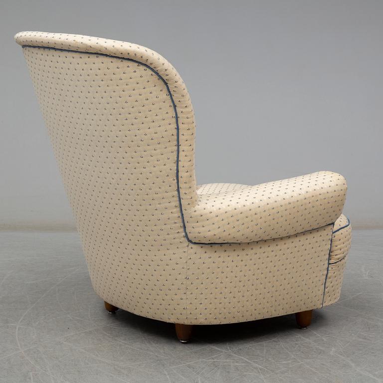 A Carl Malmsten "Jättepaddan" armchair, late 20th or early 21th century.