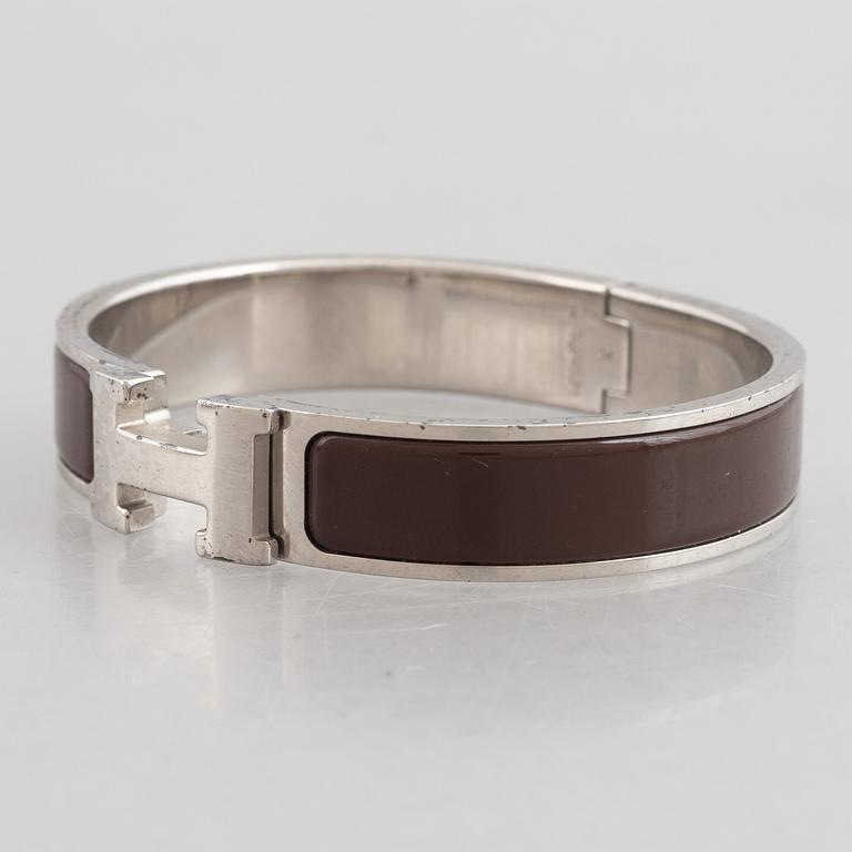 Hermès, a 'Clic H' bracelet.