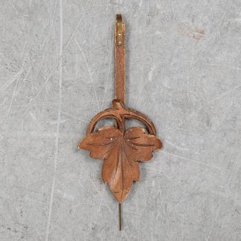 A Black Forest area pendulum wall clock.