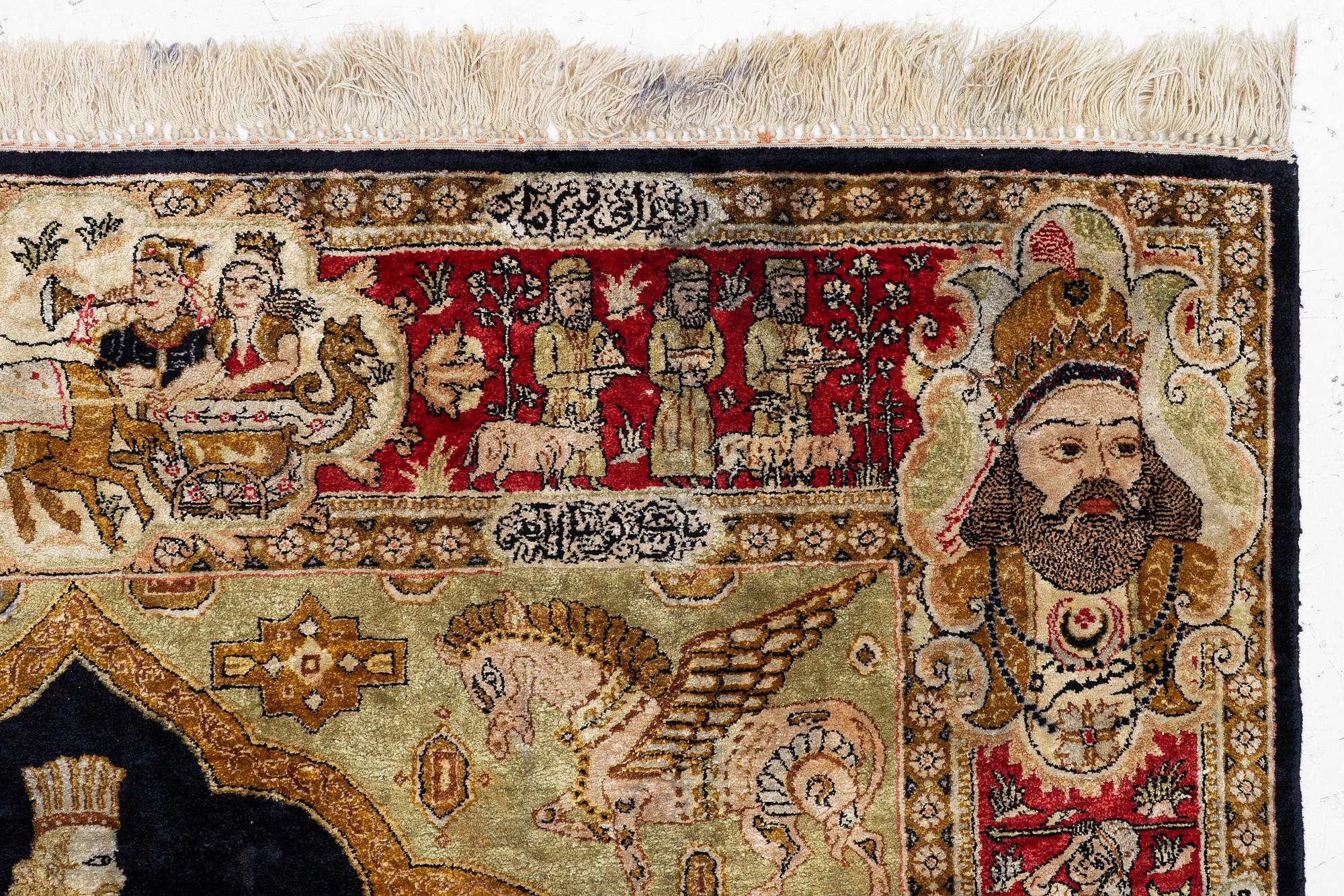 A pictorial semi-antique silk Qum rug, central Persia, c. 214 x 146 cm.