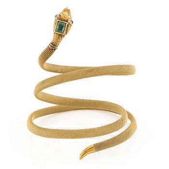 An 18K gold snake bracelet with an emerald and eight-cut diamonds.