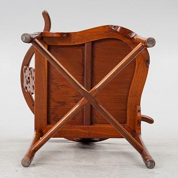 A Chinese hardwood corner armchair, 1900s.