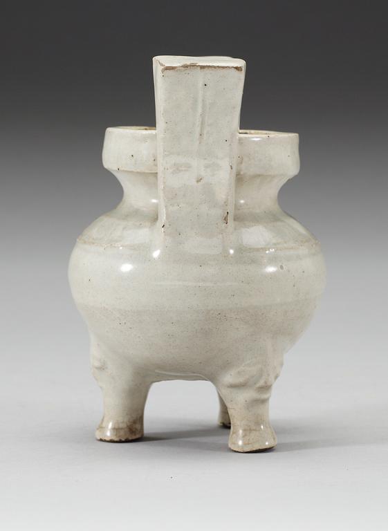A pale grey-bluish glazed tripod censer with decor in relief, and archaistic mark, Ming dynasty (1368-1644).