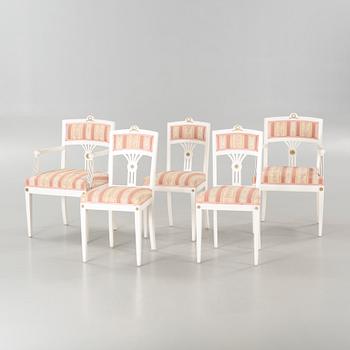 Two gustavian style armchairs and three chairs, first half of the 20th century.