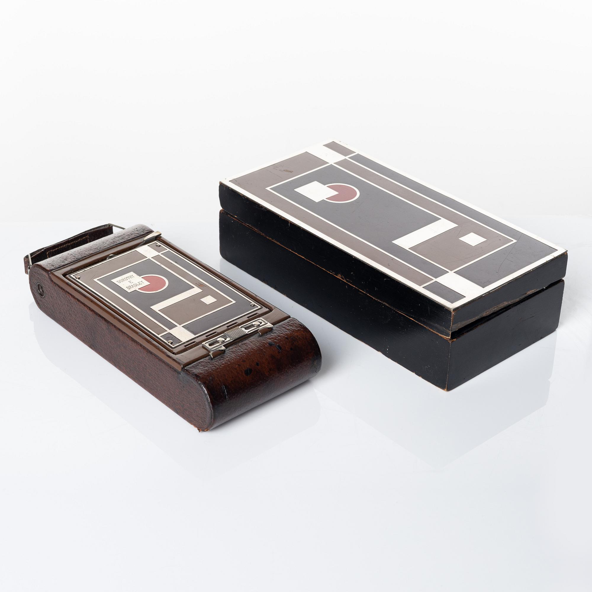 Walter Dorwin Teague, a folding camera in in a lacquered case, USA 1930s.
