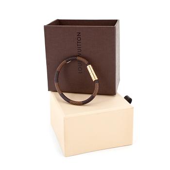 445. LOUIS VUITTON, a brown canvas bracelet.