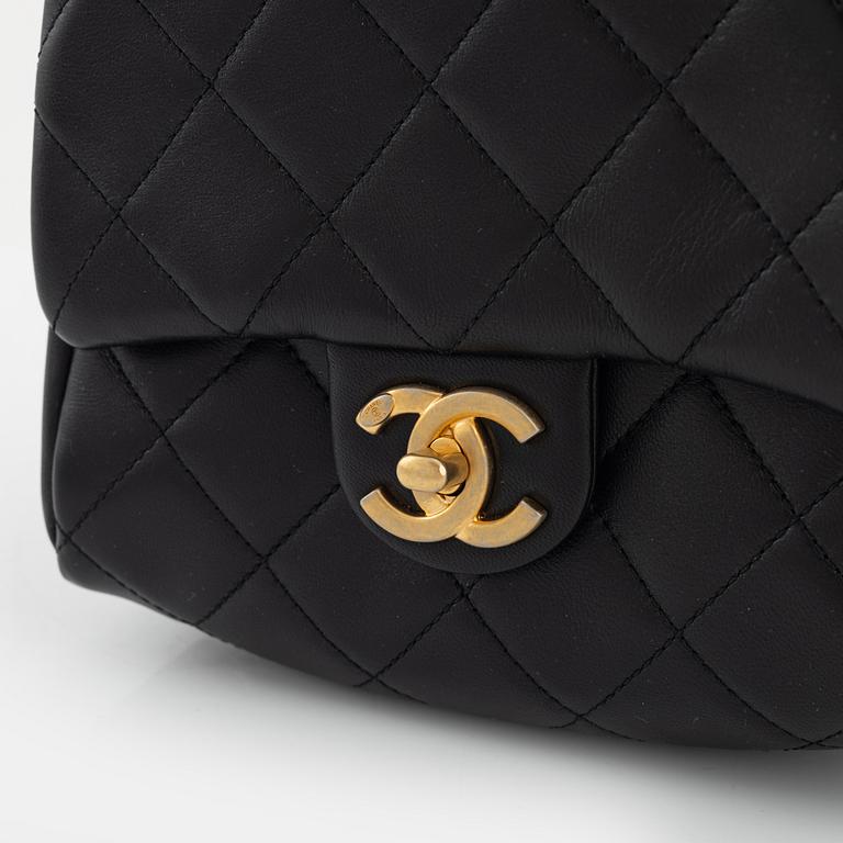 Chanel, a black leather, gold hardware and pearl chain 'Side Pack bag', 2019.