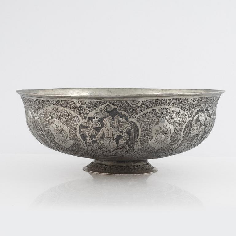 A west Asian repoussé silver and copper vessle, circa 1900.