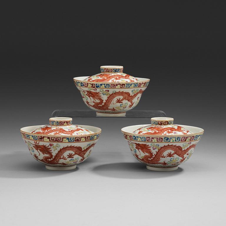 A set of three famille rose bowls with covers, Qing dynasty with Guangxu six character marks and period (1874-1908).