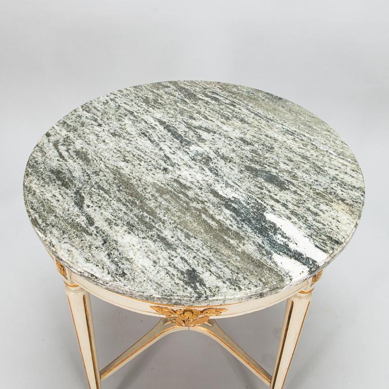 A Gustavian style sofa and table from early 20th century.