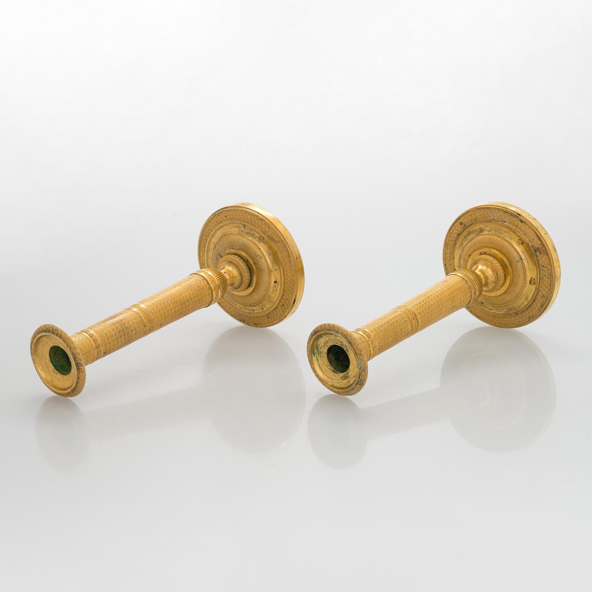 A pair of early 19th century French Empire candlesticks.