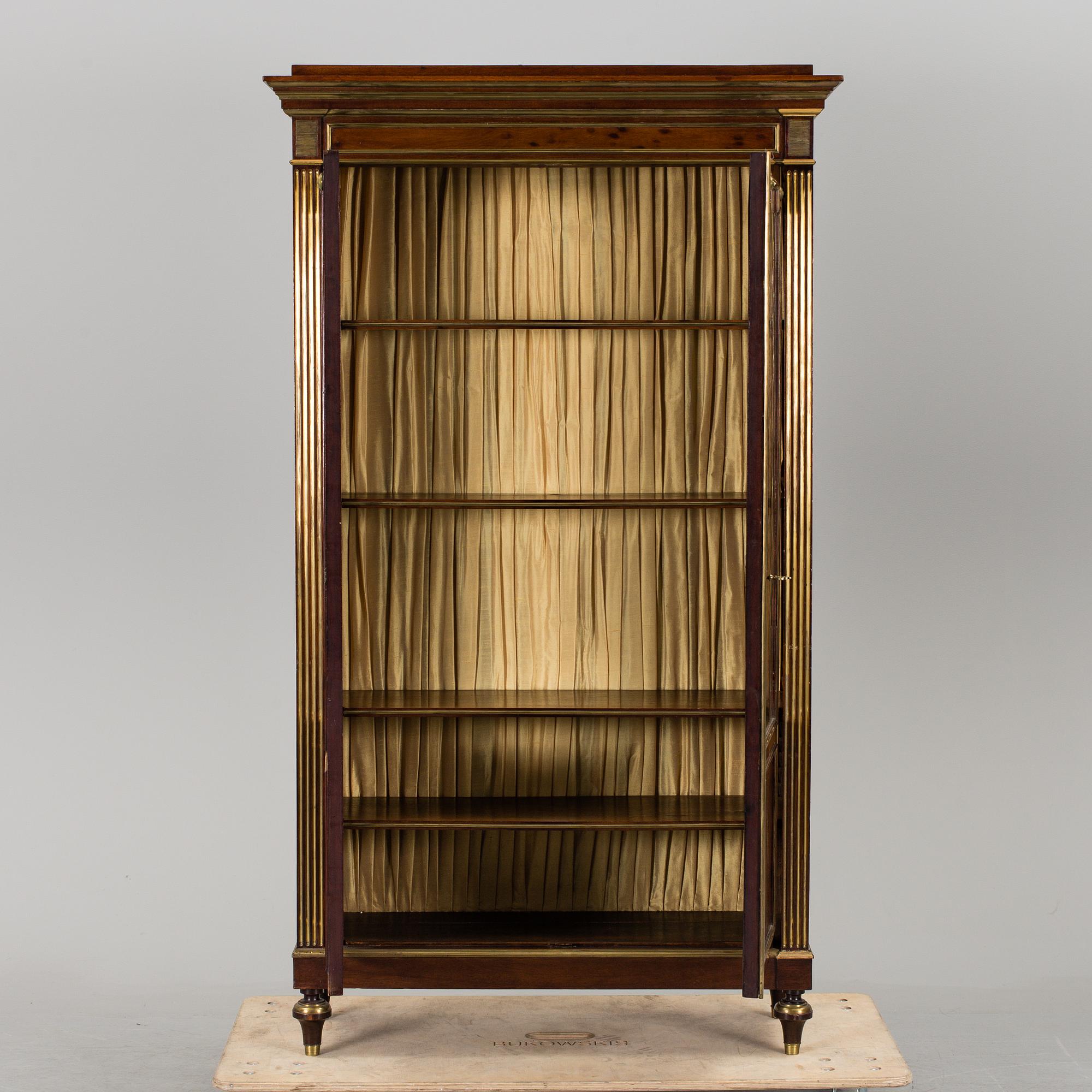 A Russian mahogany veneered display cabinet from around year 1900.